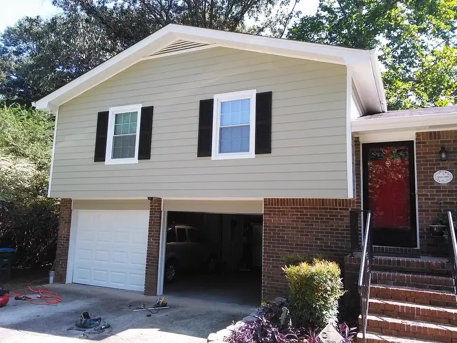 Fiber cement siding replacement with gable and dormer trim work