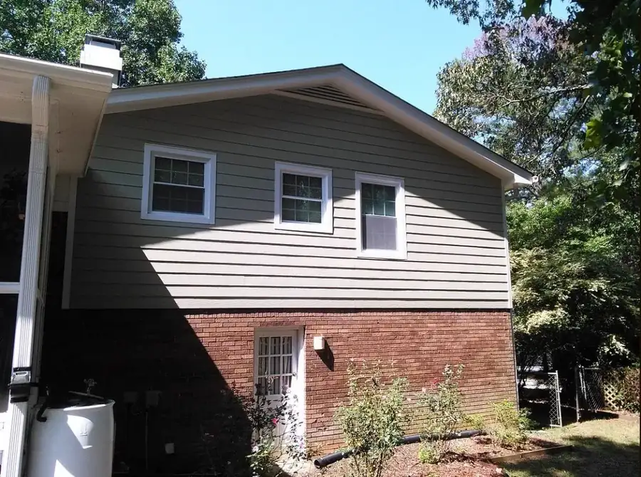 Rear elevation with new fiber cement siding and trim